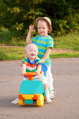 Two brothers, one with Down syndrome, have fun playing.