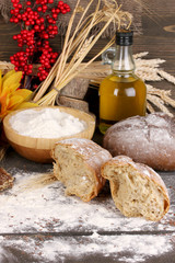 Rye bread on wooden table on wooden background