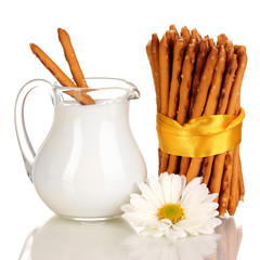 Tasty crispy sticks with pitcher with sour cream isolated