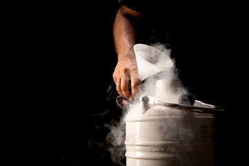 Pouring liquid nitrogen - obrazy, fototapety, plakaty