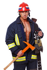 Portrait of handsome man posing on black background in fireman c