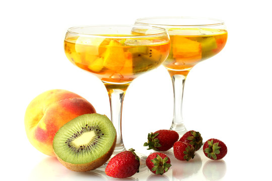punch in glasses with fruits, isolated on white