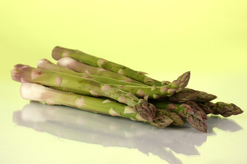 Fresh asparagus on colorful background.