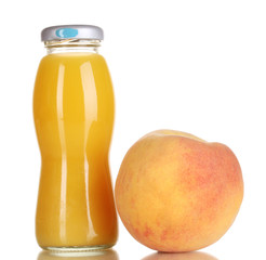 Delicious peach juice in glass bottle and peach next to it
