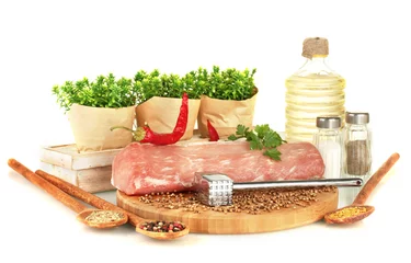 Foto op Canvas composition of raw meat, vegetables and spices isolated on © Africa Studio