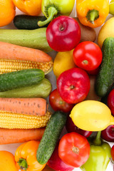 Assortment of fresh vegetables and fruits as a background