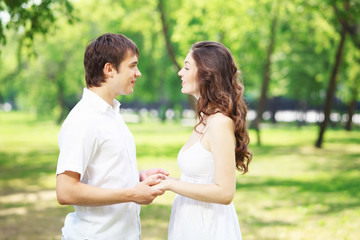 Young love Couple smiling under blue sky