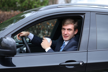 Fototapeta na wymiar young attractive man young man in the car