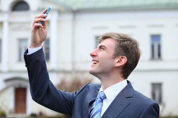 young attractive man calling by phone