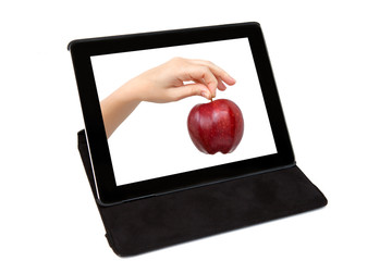 tablet with the hand and a red apple on the screen