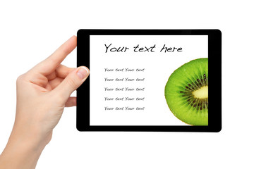 woman hand hold a mini tablet with kiwi on a screen