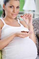 Pregnant woman eating almond