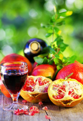 Glass of Red wine and pomegranates
