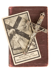 Silver cross and old holy bible