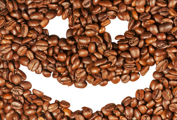 Smiling face on the background of coffee beans