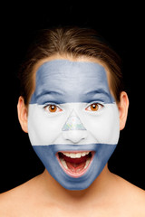 girl with nicaraguan flag on her face