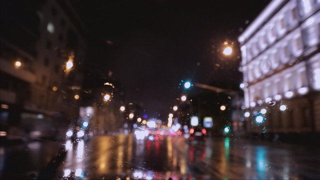 car window rain night background defocused in motion