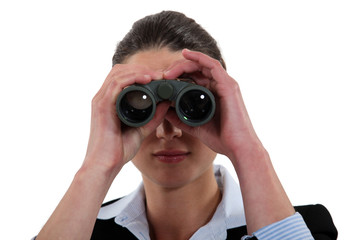 Businesswoman with binoculars