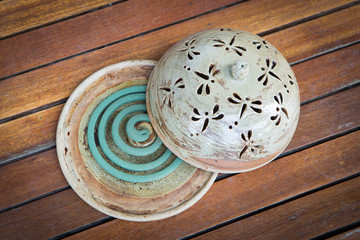 Mosquito coil on ceramic tray