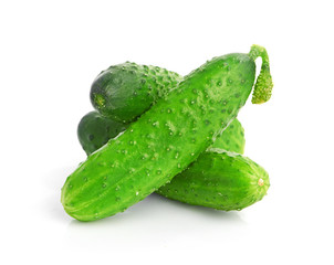 green cucumbers on white