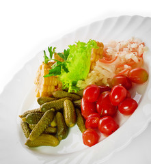 pickled vegetables of tomato, cucumber, cabbage isolated