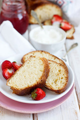 Fototapeta na wymiar Sweet bread with whipped cream and fresh strawberry