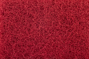 Red abrasive sponge texture background - obrazy, fototapety, plakaty