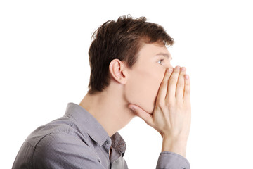 Young caucasian businessman telling gossip