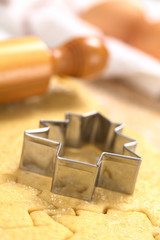Baking Christmas Cookies: Cookie cutter on rolled out dough
