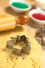 Baking Christmas Cookies: Cookie cutter on rolled out dough