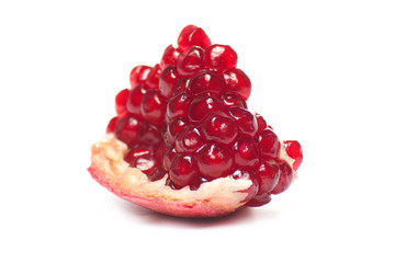 Ripe pomegranate piece isolated on white background