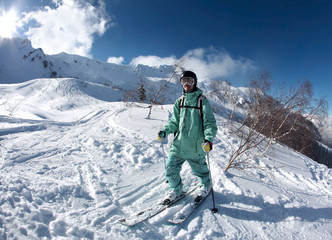 Fototapeta na wymiar Skier in the mountains at Krasnaya Polyana