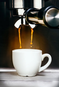 Coffee machine pouring espresso coffee