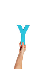 hand holding up the letter Y from the bottom