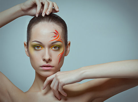 Fashion make-up with face art.