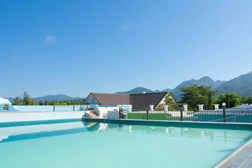 swimming pool besides mountains