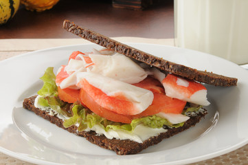 Crab sandwich on pumpernickel bread