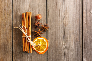 Cinnamon sticks over wooden table