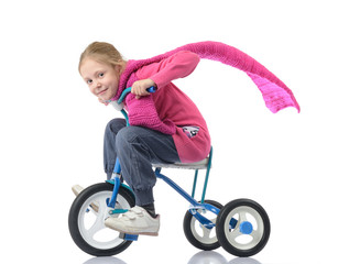 The little girl on a children's bicycle