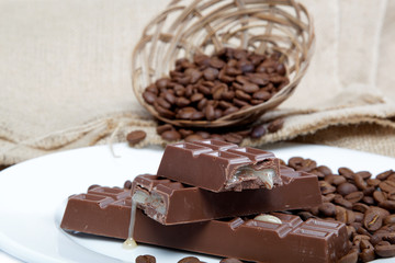 Chocolate and coffee beans on sacking.