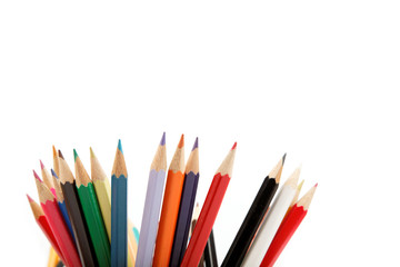 Close up of color pencils with different color over white backgr
