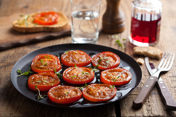 baked tomatoes with herbs and olive oil