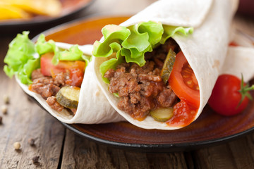 tortilla wraps with meat and vegetables