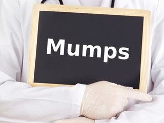 Doctor shows information on blackboard: mumps