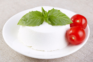 Ricotta with cherry tomatoes and a basil