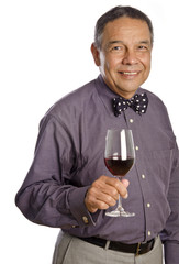 Mature Hispanic Man Tasting Red Wine
