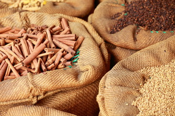 Big bag with cinnamon sticks in indian market