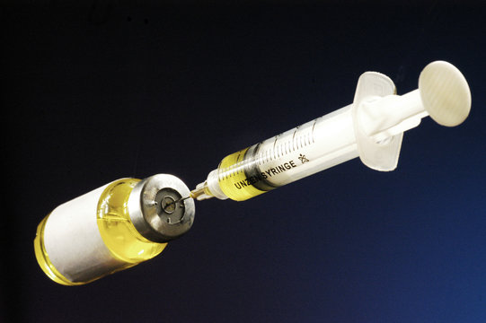 needle and bottle of medicine