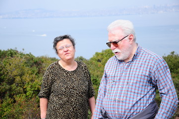 Happy elderly seniors couple in nature