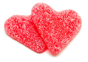 two heart-shaped candies isolated on white background